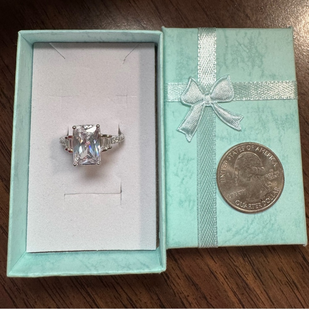 Elegant Silver-Tone Ring with Clear Emerald-Cut Stone